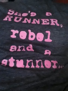 More like, "She's a runner, rebel and a junk food eater...
